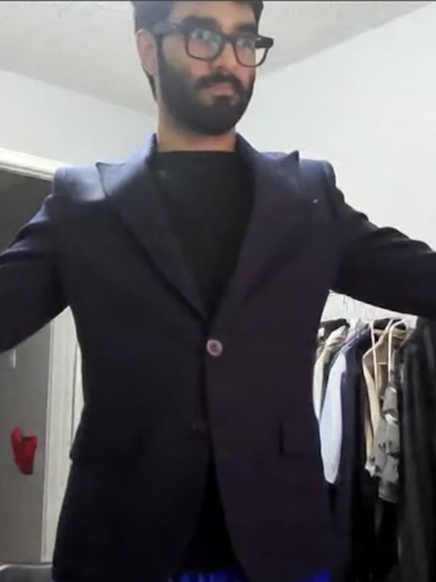 The same navy peak-lapel blazer, generated live on the shopper.