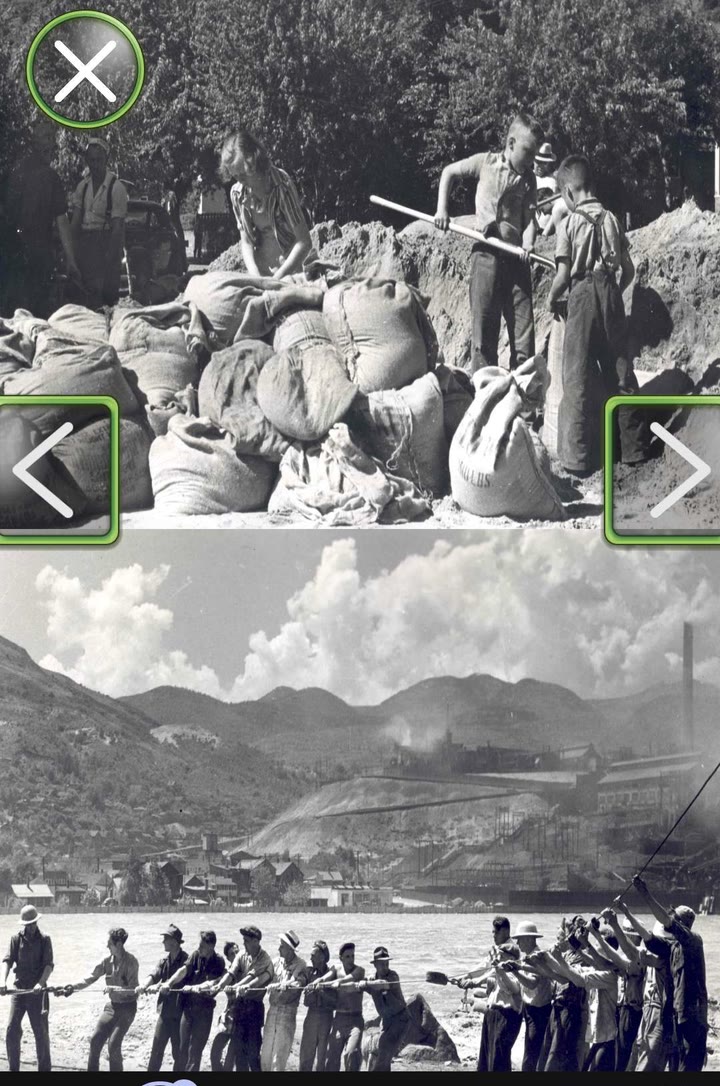 Archival photograph in the AR experience: a wall of filled sandbags with residents working behind it, above a line of men hauling a rope against the current.